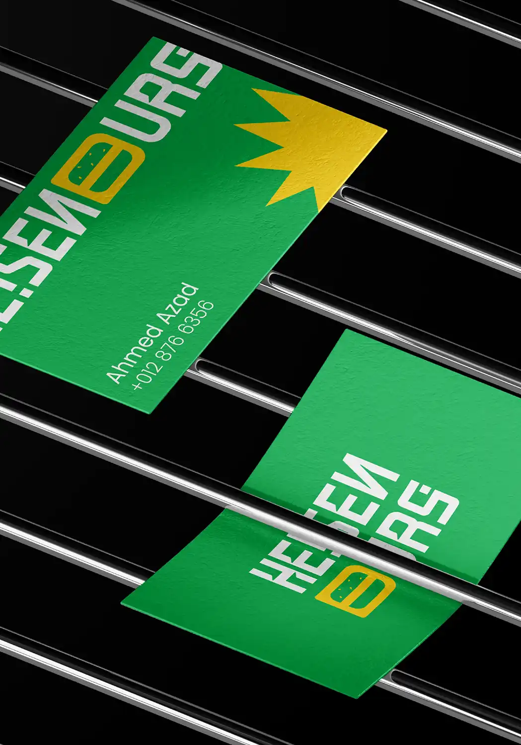 Heisenburg burger photography on green with the geometric white wordmark and yellow burger-form character.