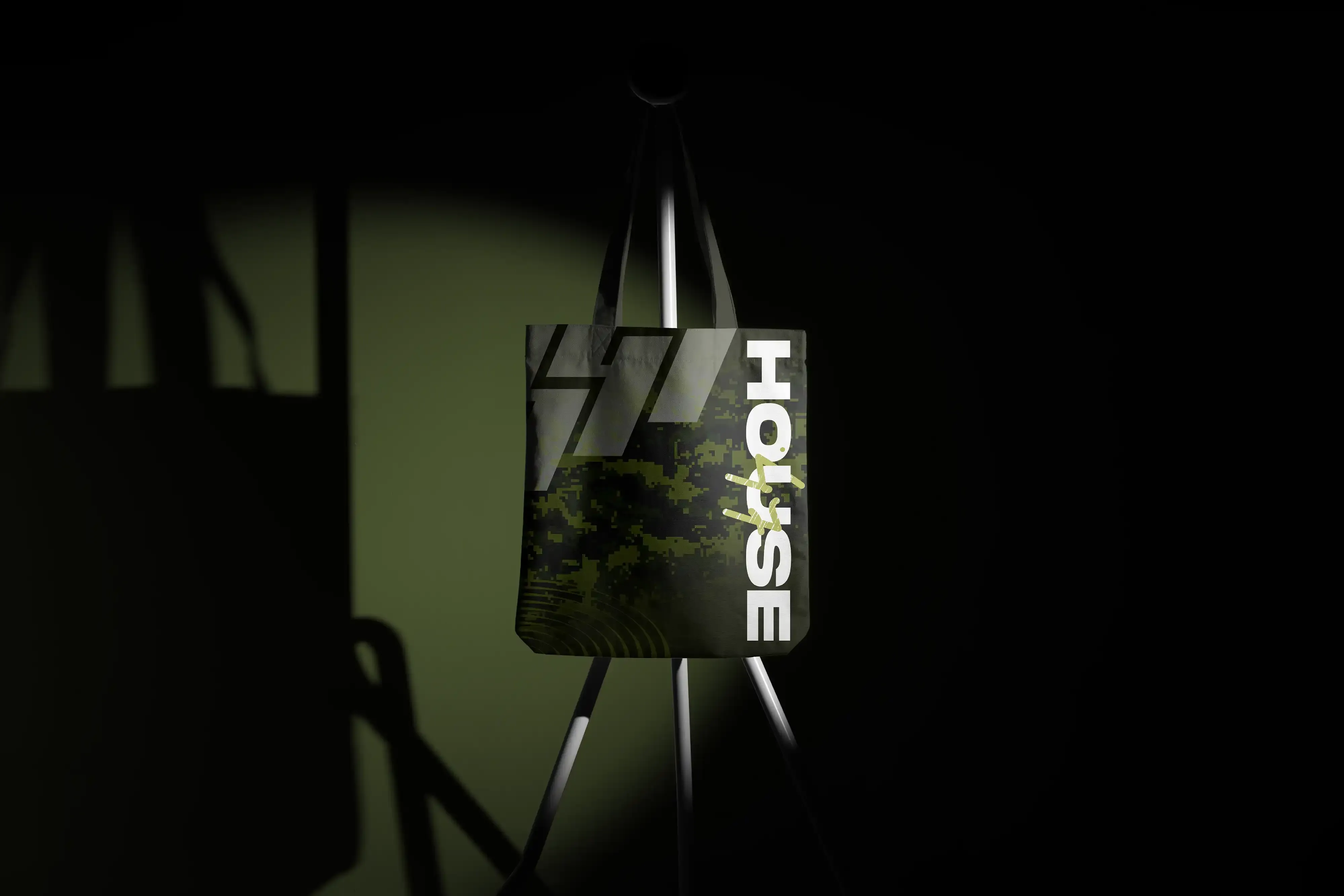 House47 patterned tote bag displayed in a dark studio setting.